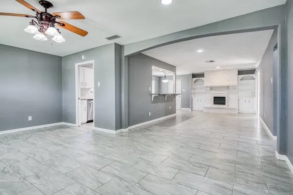a view of a kitchen with a sink and a large window