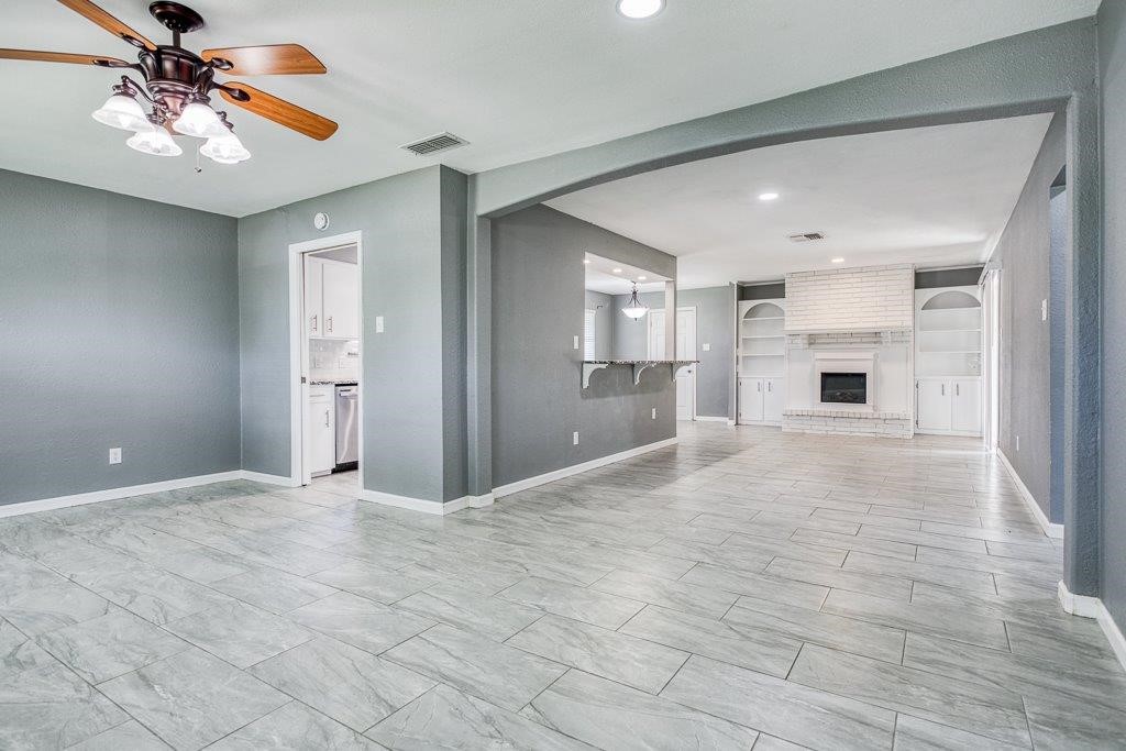 1810 Marlin Street Portland, TX 78374 - Photo 7 of 32 a view of a kitchen with a sink and a chandelier fan