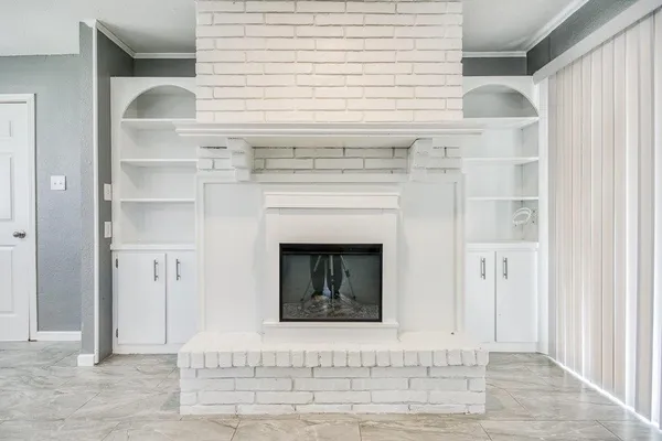 a view of a kitchen with a sink and dishwasher cabinets