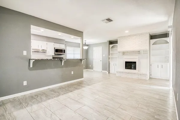 a view of a kitchen with a sink and a stove top oven