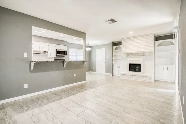 a view of a kitchen with a sink and a stove top oven