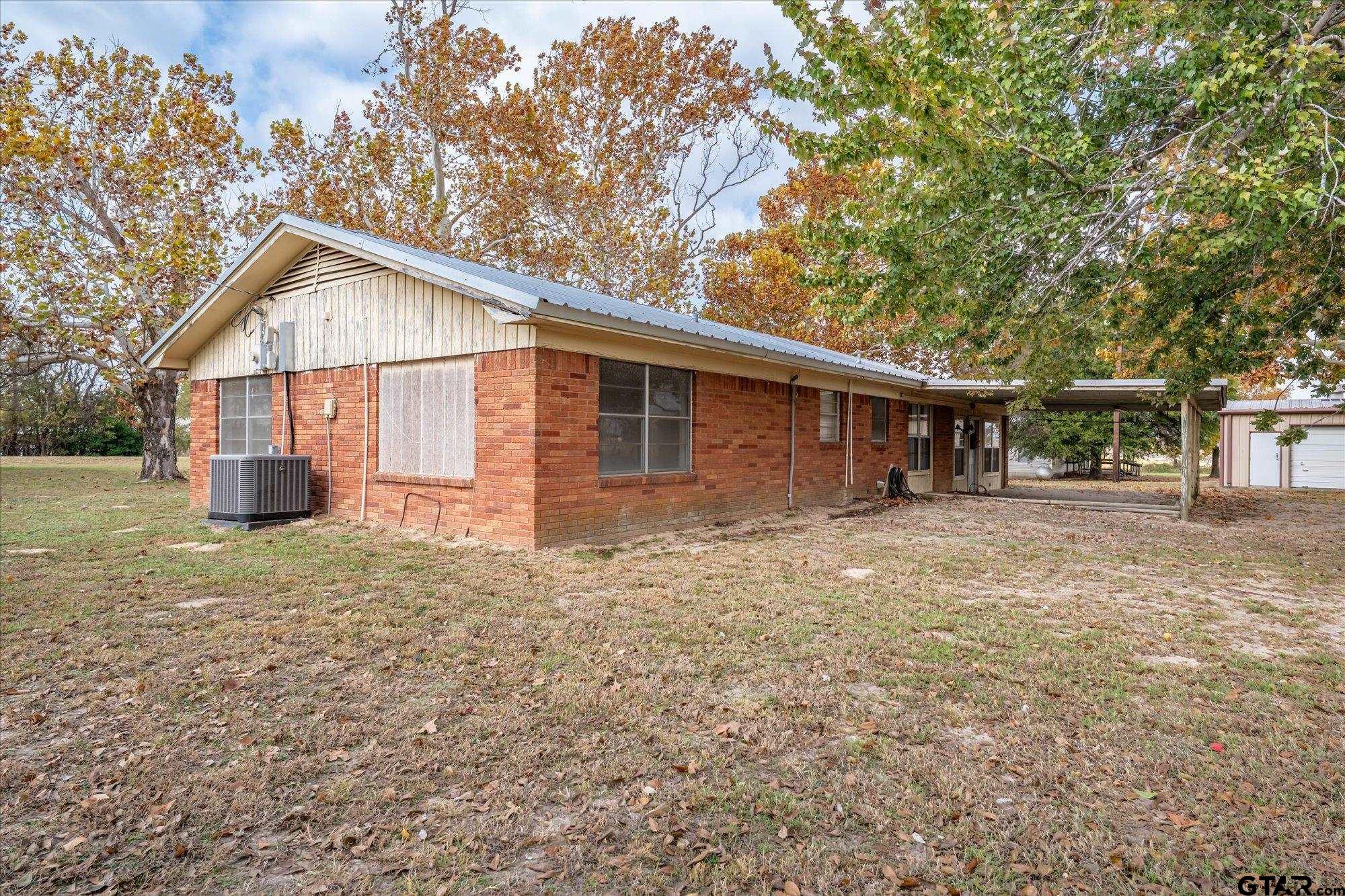 11619 County Road 4331 Larue, TX 75770 - Photo 19 of 30 a front view of house with yard and trees around