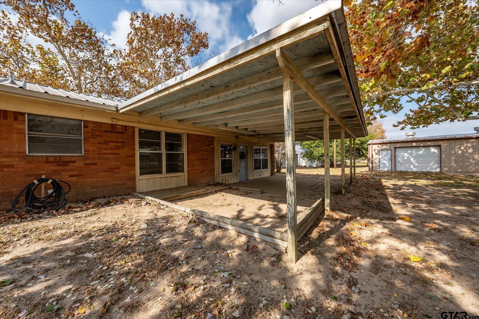 11619 County Road 4331 Larue, TX 75770 - Photo 22 of 30 a backyard of a house with yard and outdoor seating