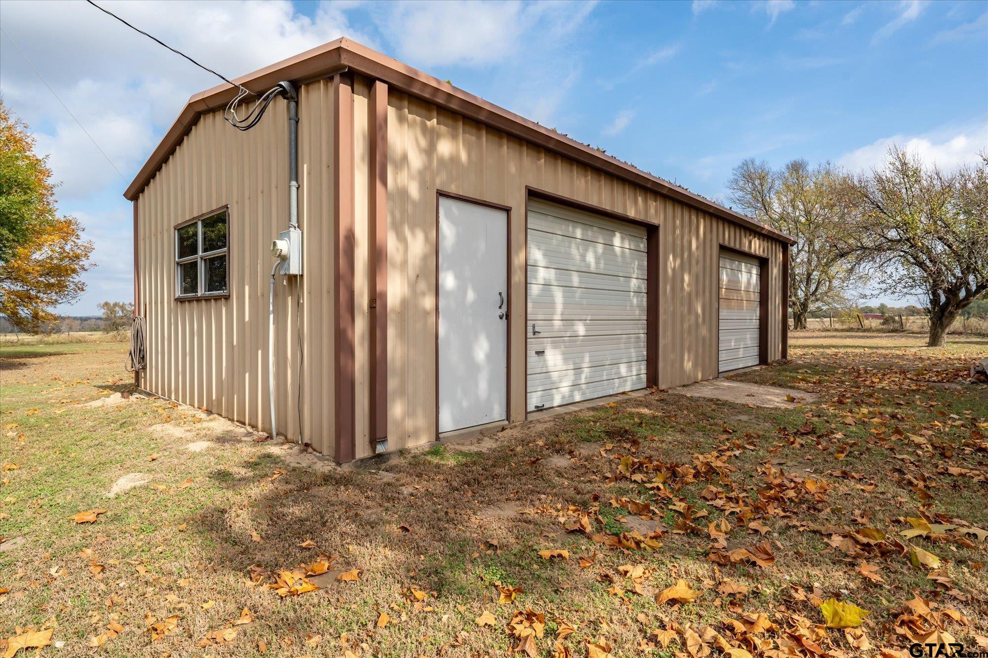 11619 County Road 4331 Larue, TX 75770 - Photo 26 of 30 a view of a house with backyard and trees