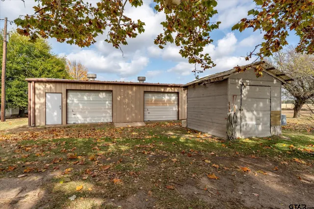a view of backyard with large trees