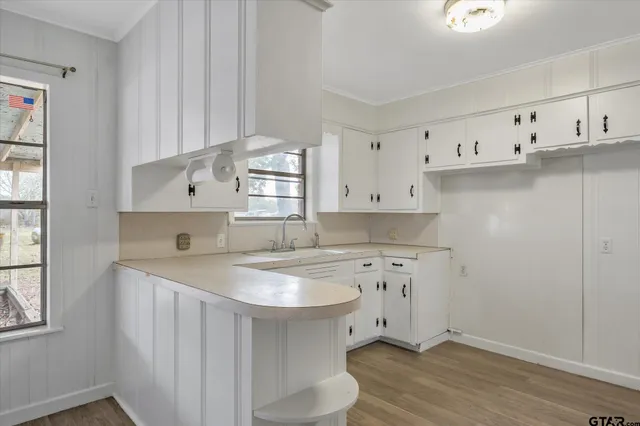 a kitchen with cabinets a sink and a stove