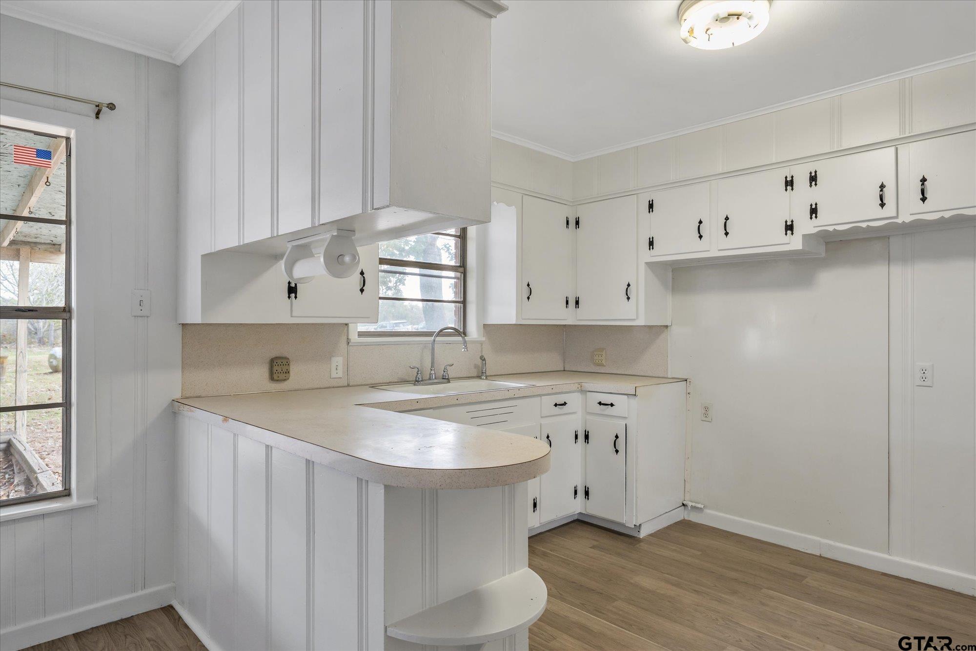 11619 County Road 4331 Larue, TX 75770 - Photo 4 of 30 a kitchen with cabinets a sink and a stove