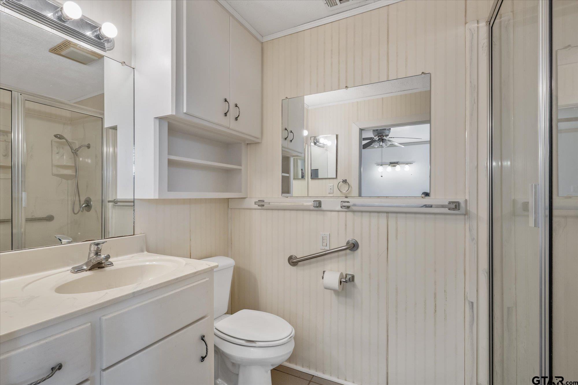 11619 County Road 4331 Larue, TX 75770 - Photo 8 of 30 a bathroom with a sink a toilet and a mirror