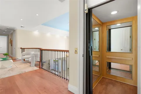 a large white kitchen with a large window