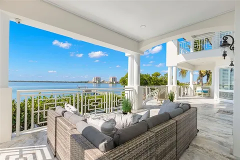 a living room with furniture appliances and a large window