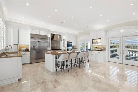 a view of a balcony with chair and table