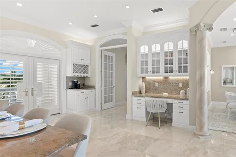 a kitchen with a sink cabinets and window