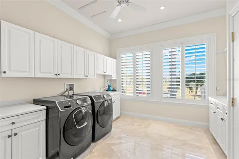 a view of a chairs and table in the room