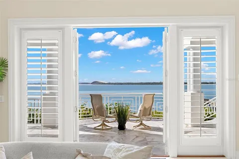 a view of a swimming pool with an outdoor space and seating area