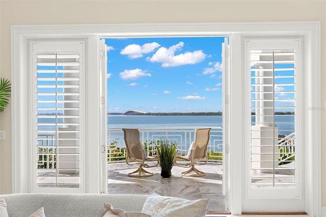 a view of a swimming pool with an outdoor space and seating area