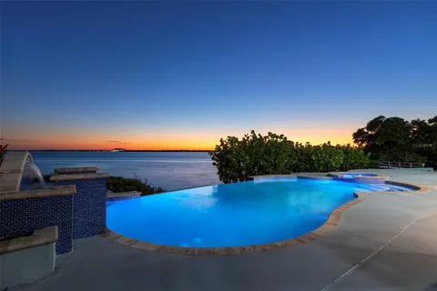 a view of a chairs and table in a patio