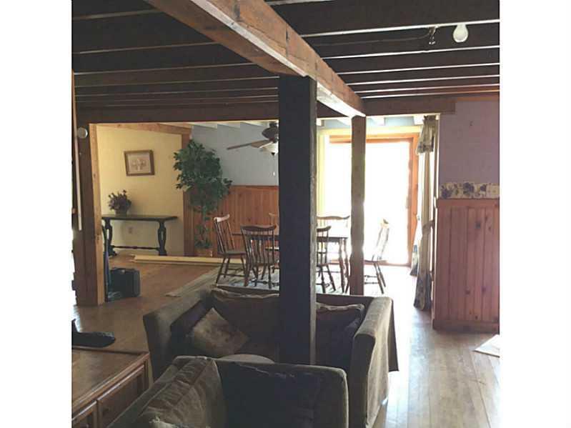 69 West Shore Road Sebago, ME 04029 - Photo 8 of 12 Family Room. Big eat in kitchen on...