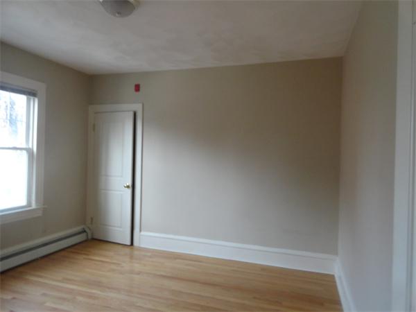 34 Meadow Road, Unit 4 Woonsocket, RI 02895 - Photo 11 of 12 a view of an empty room with wooden floor and a window