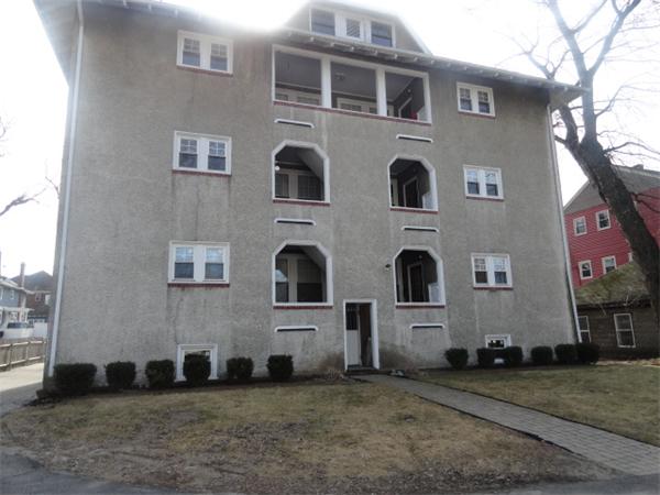 34 Meadow Road, Unit 4 Woonsocket, RI 02895 - Photo 3 of 12 a front view of a house with a yard