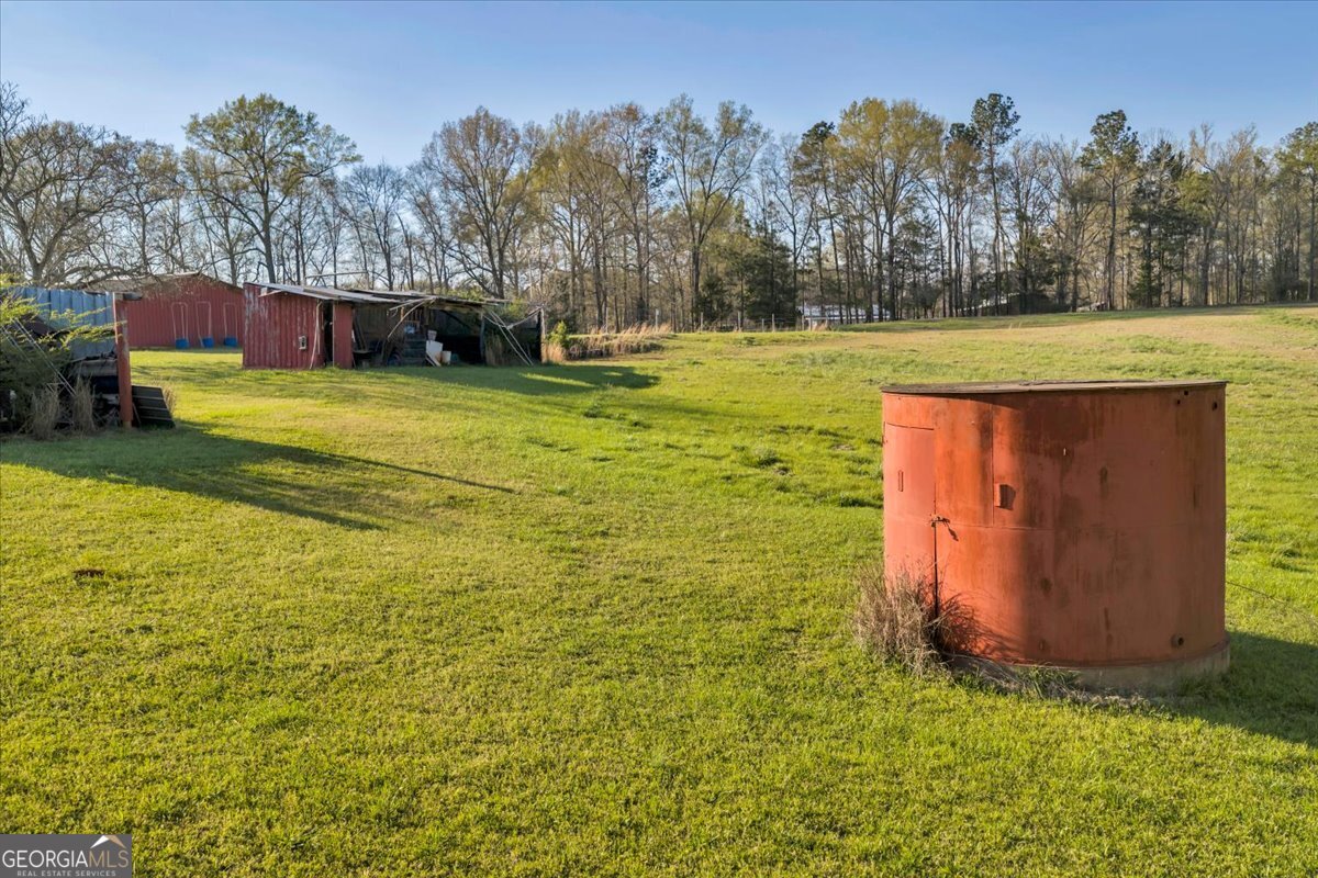 1730 Stallings Road Haddock, GA 31033 - Photo 11 of 28 a view of a house with a yard