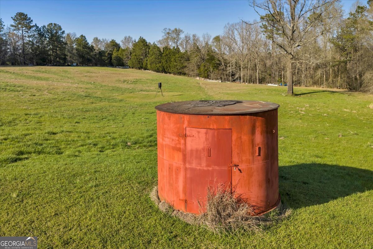 1730 Stallings Road Haddock, GA 31033 - Photo 12 of 28 a view of a field with an trees in the background
