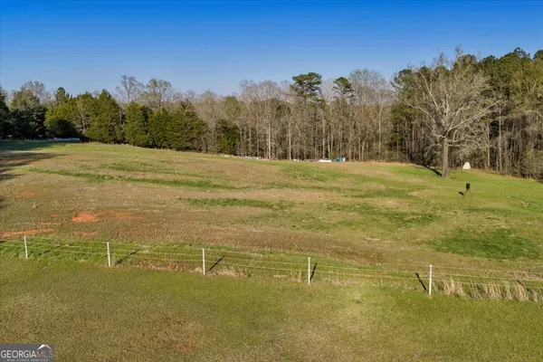 a view of a yard with an ocean