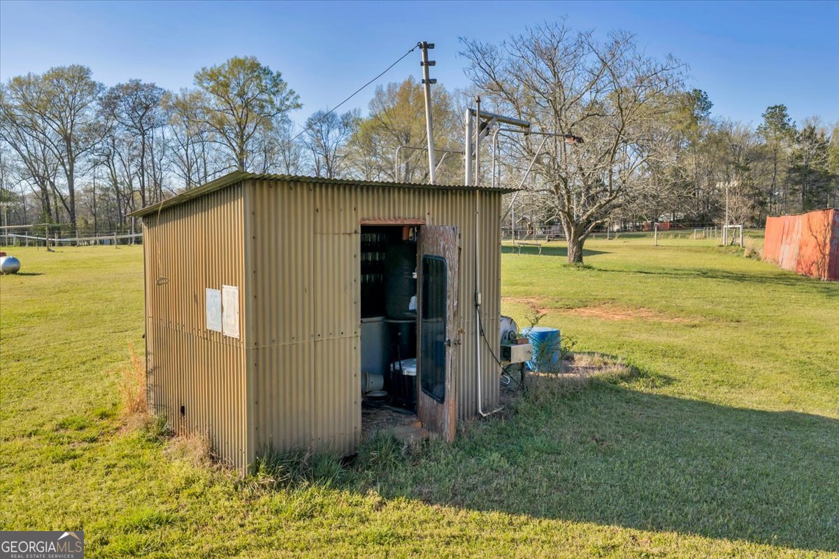 1730 Stallings Road Haddock, GA 31033 - Photo 19 of 28 a view of a house with a yard