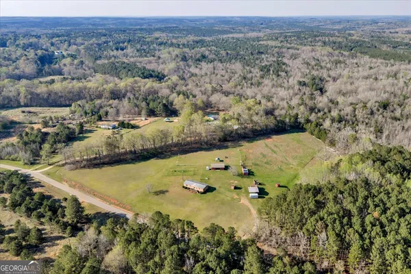 an aerial view of houses with yard