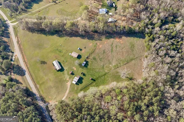 a view of a pool with a yard
