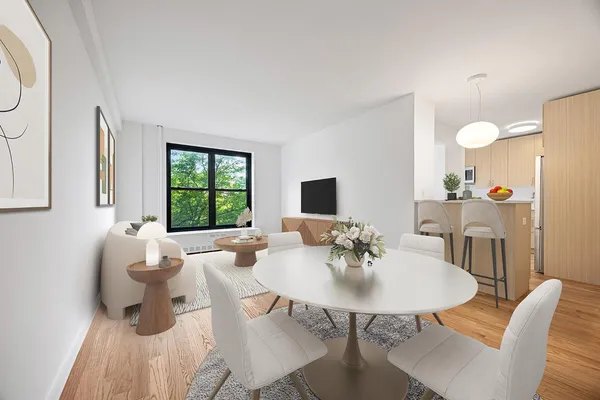 a view of a dining room with furniture and wooden floor