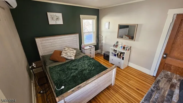a view of a living room with wooden floor
