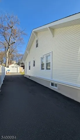 a view of a house with a street