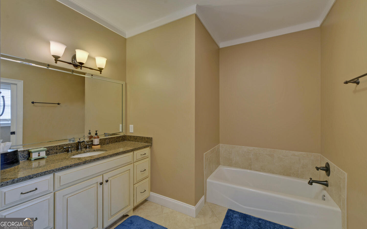 29 Cottage Lane Toccoa, GA 30577 - Photo 18 of 49 a bathroom with a granite countertop sink a mirror and a bathtub