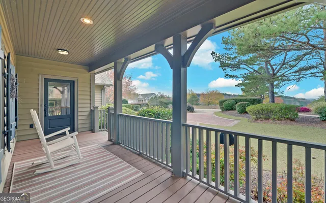 a view of a room with wooden floor and wooden fence