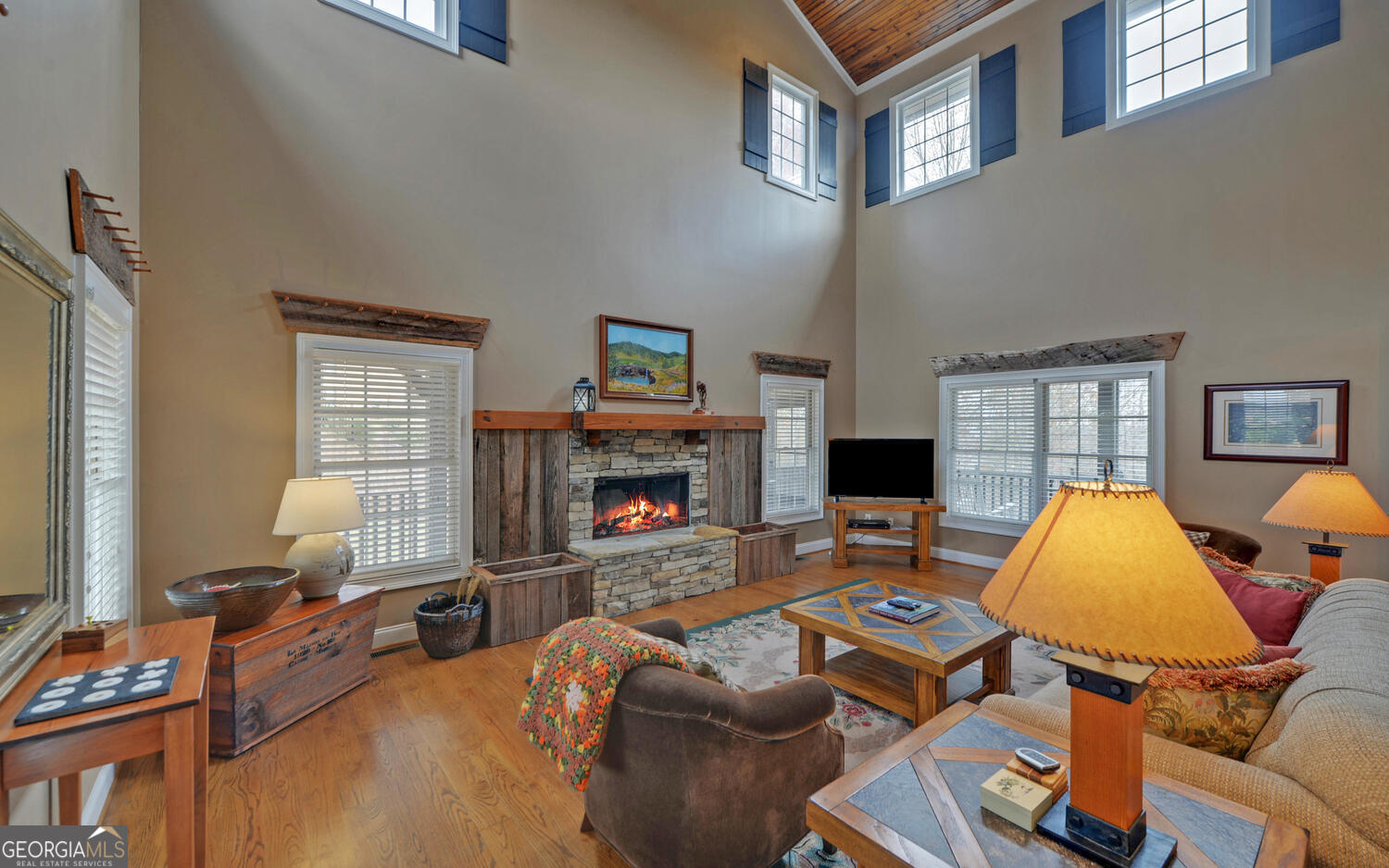 29 Cottage Lane Toccoa, GA 30577 - Photo 8 of 49 a living room with furniture a fireplace and a flat screen tv