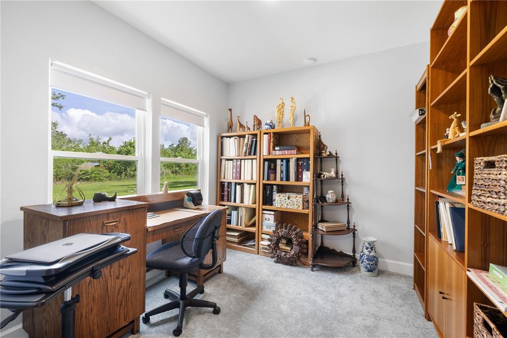 5149 Southwest 119th Road Lake Butler, FL 32054 - Photo 32 of 40 a view of a workspace with furniture and a window
