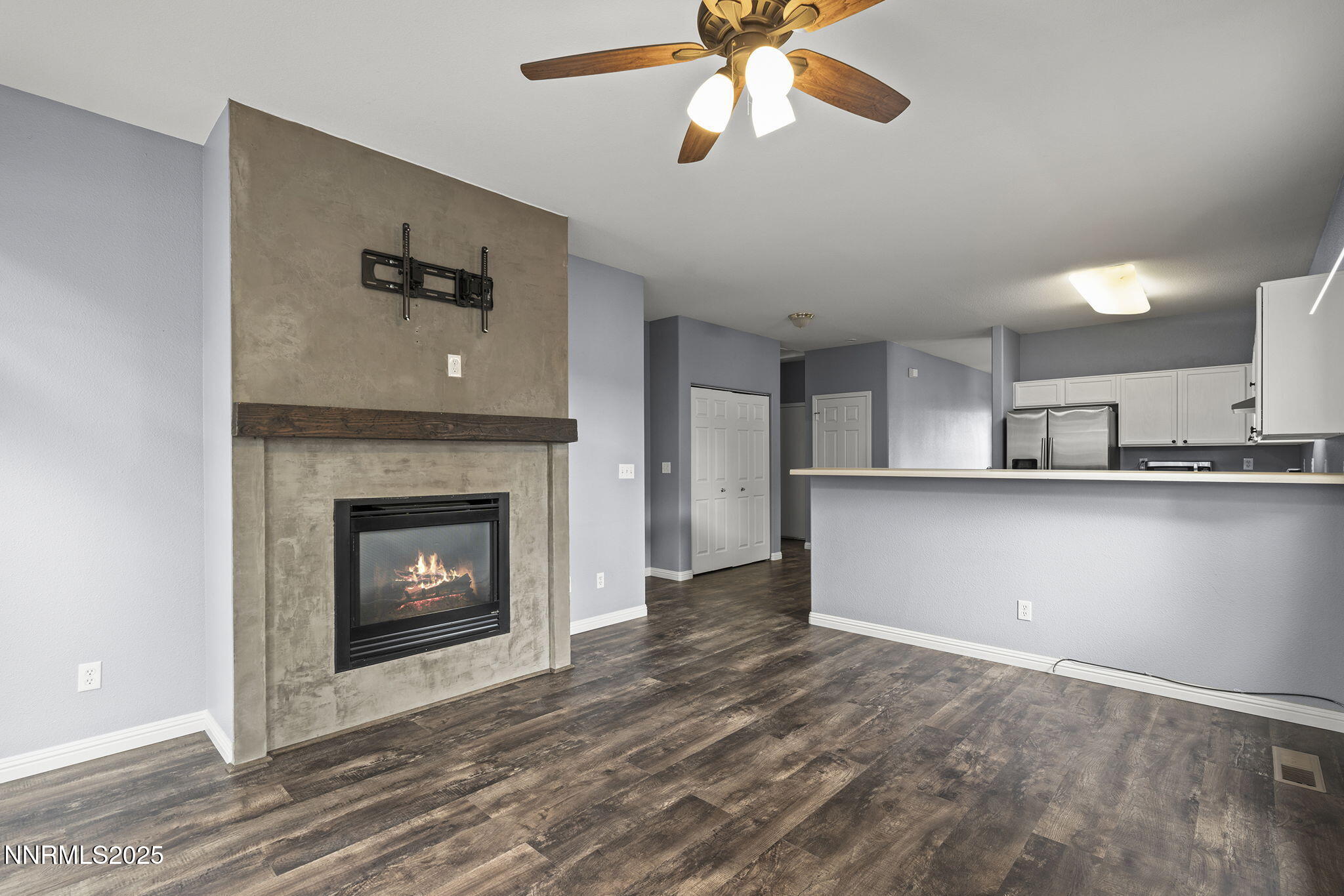 5897 September Circle Reno, NV 89523 - Photo 13 of 24 a view of kitchen and empty room with wooden floor