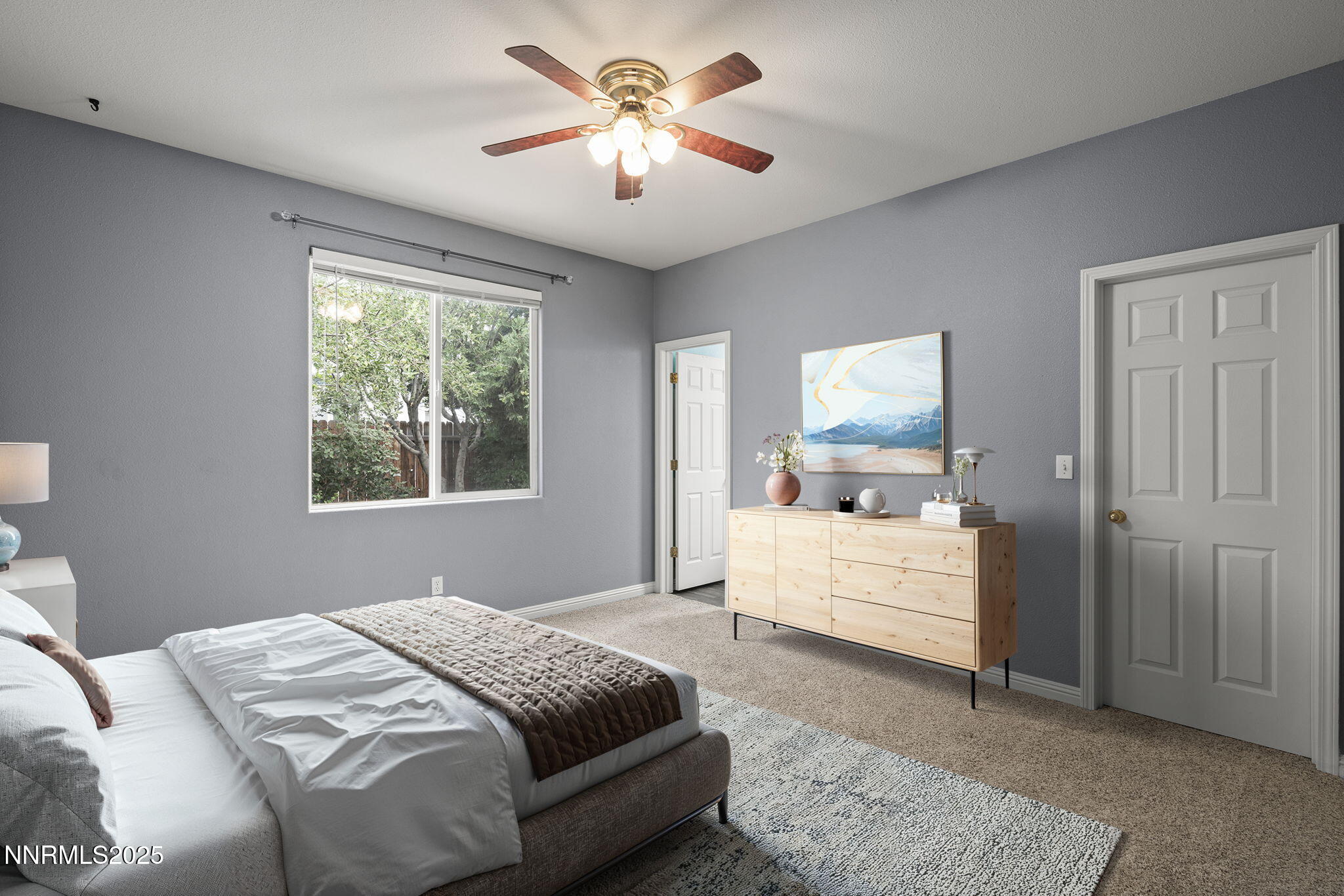 5897 September Circle Reno, NV 89523 - Photo 15 of 24 a bedroom with a large bed and a chandelier