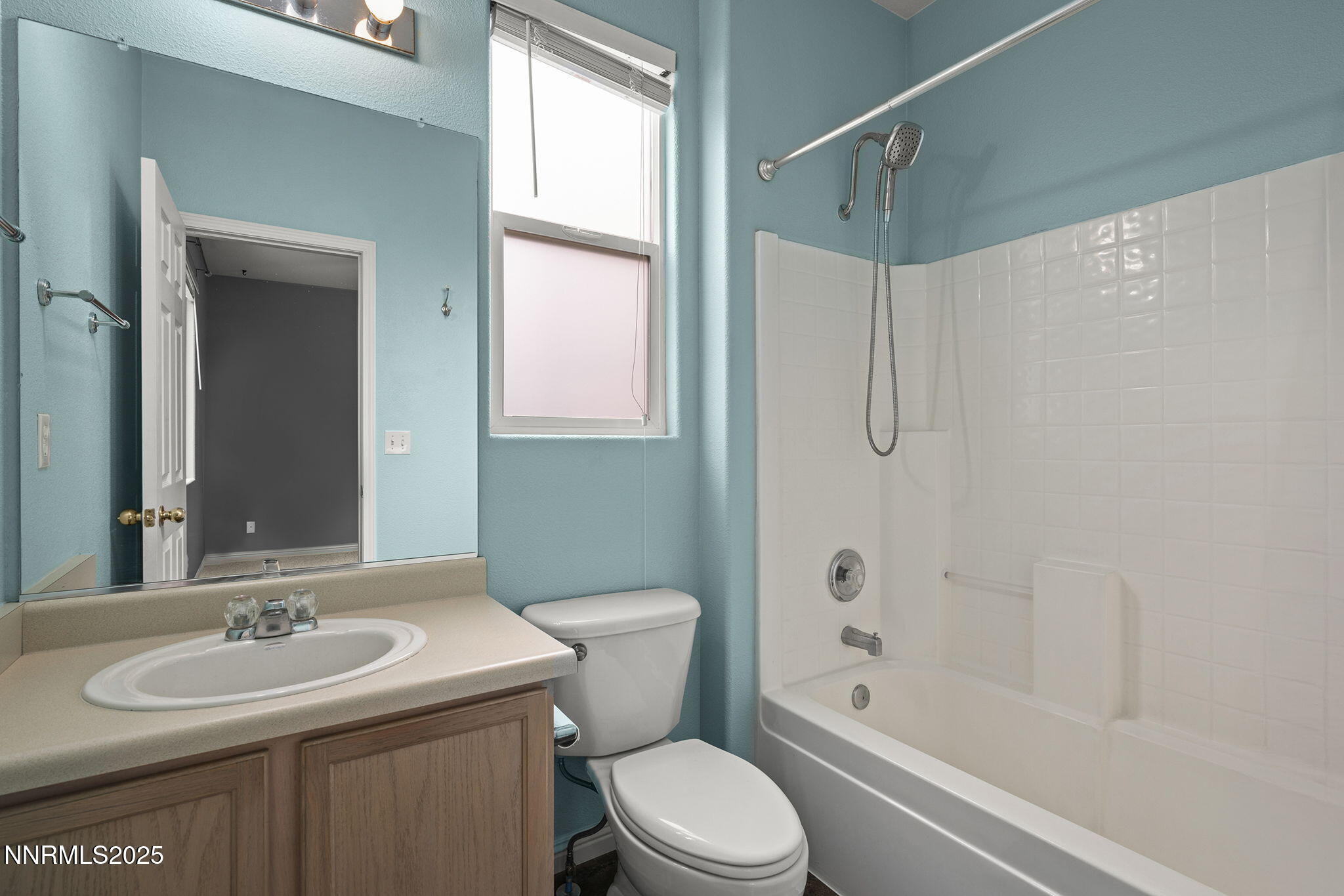 5897 September Circle Reno, NV 89523 - Photo 17 of 24 a bathroom with a sink toilet vanity and shower