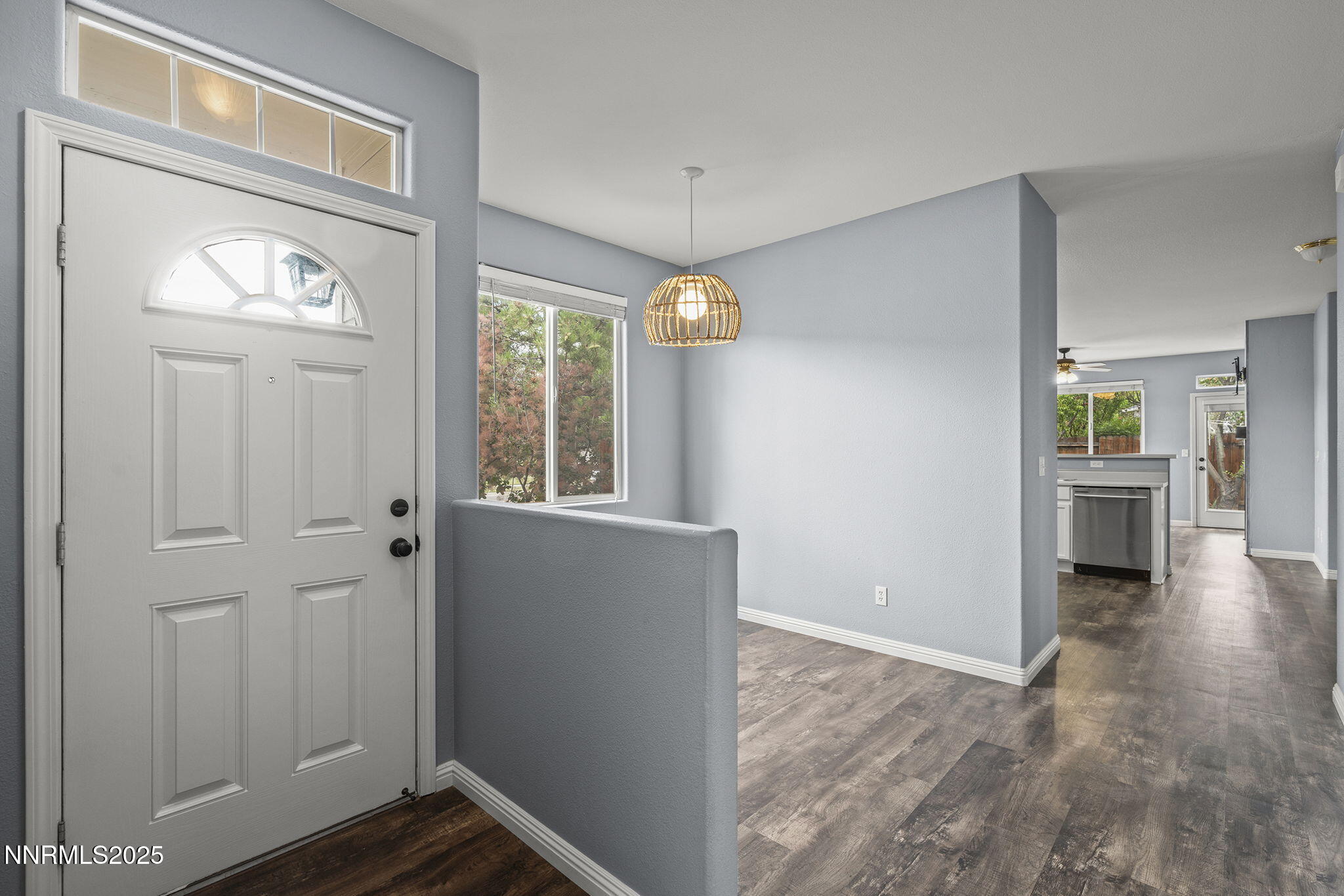 5897 September Circle Reno, NV 89523 - Photo 4 of 24 a view of an entryway with wooden floor and a livingroom