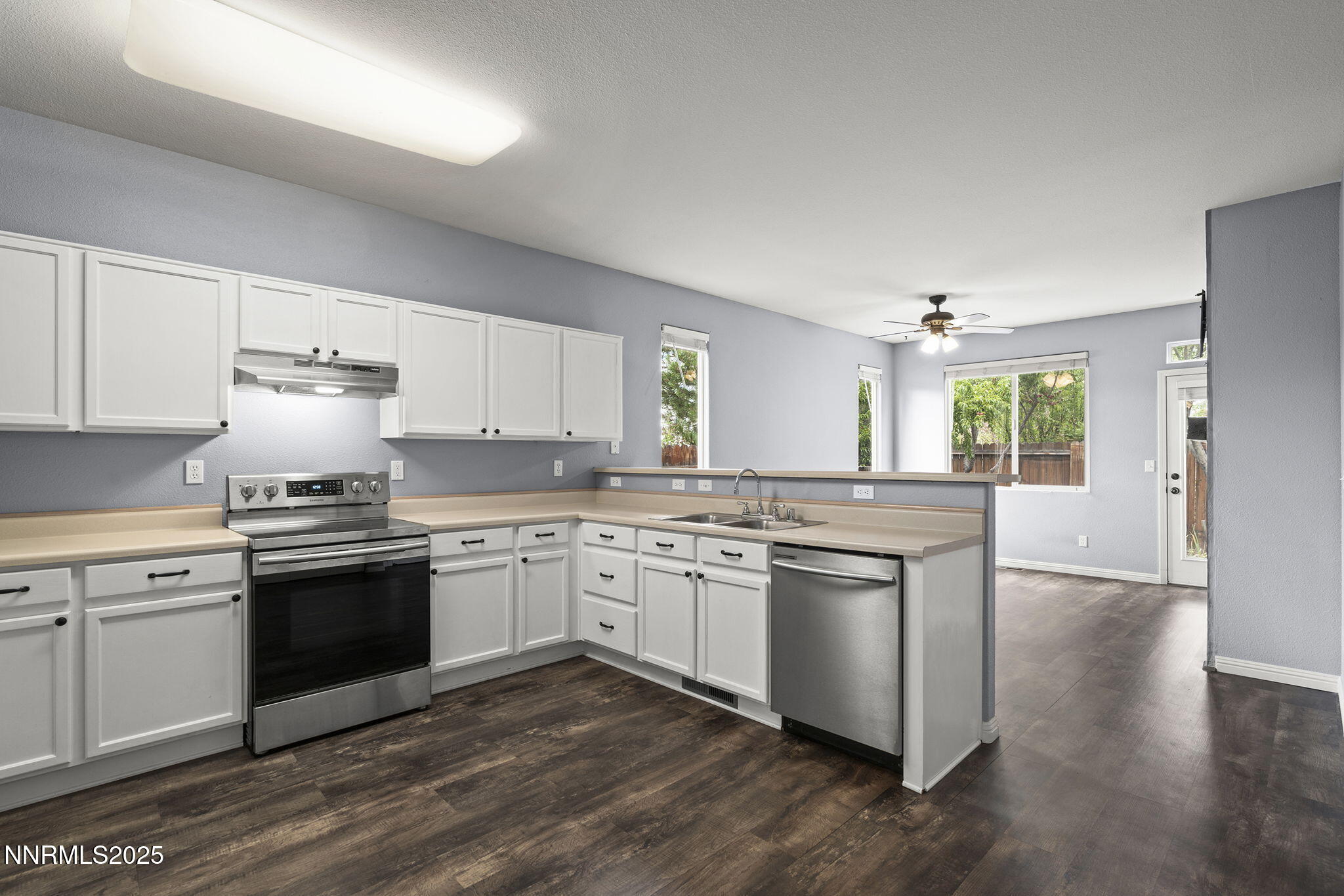 5897 September Circle Reno, NV 89523 - Photo 7 of 24 a kitchen with a stove top oven sink and cabinets