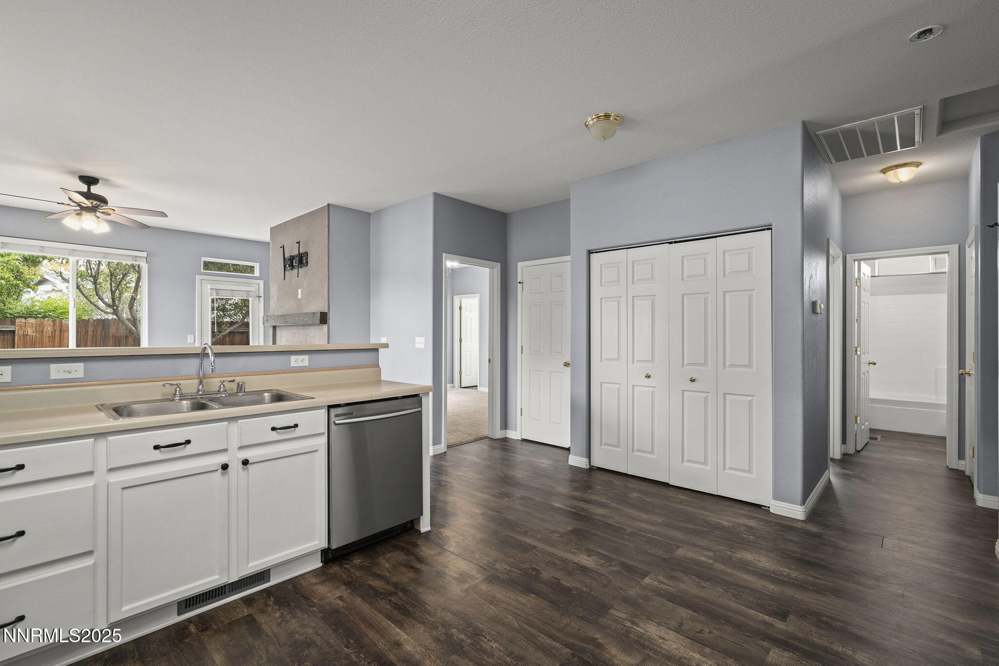 5897 September Circle Reno, NV 89523 - Photo 9 of 24 a view with cabinets and wooden floor