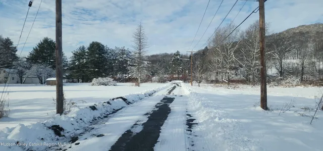 a view of a yard covered in snow