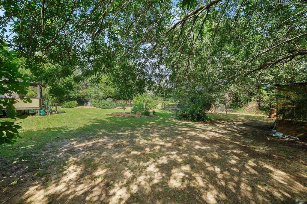 252 Meadow Lake Estates Road Denison, TX 75021 - Photo 16 of 37 Spacious outdoor area featuring mature trees providing ample shade