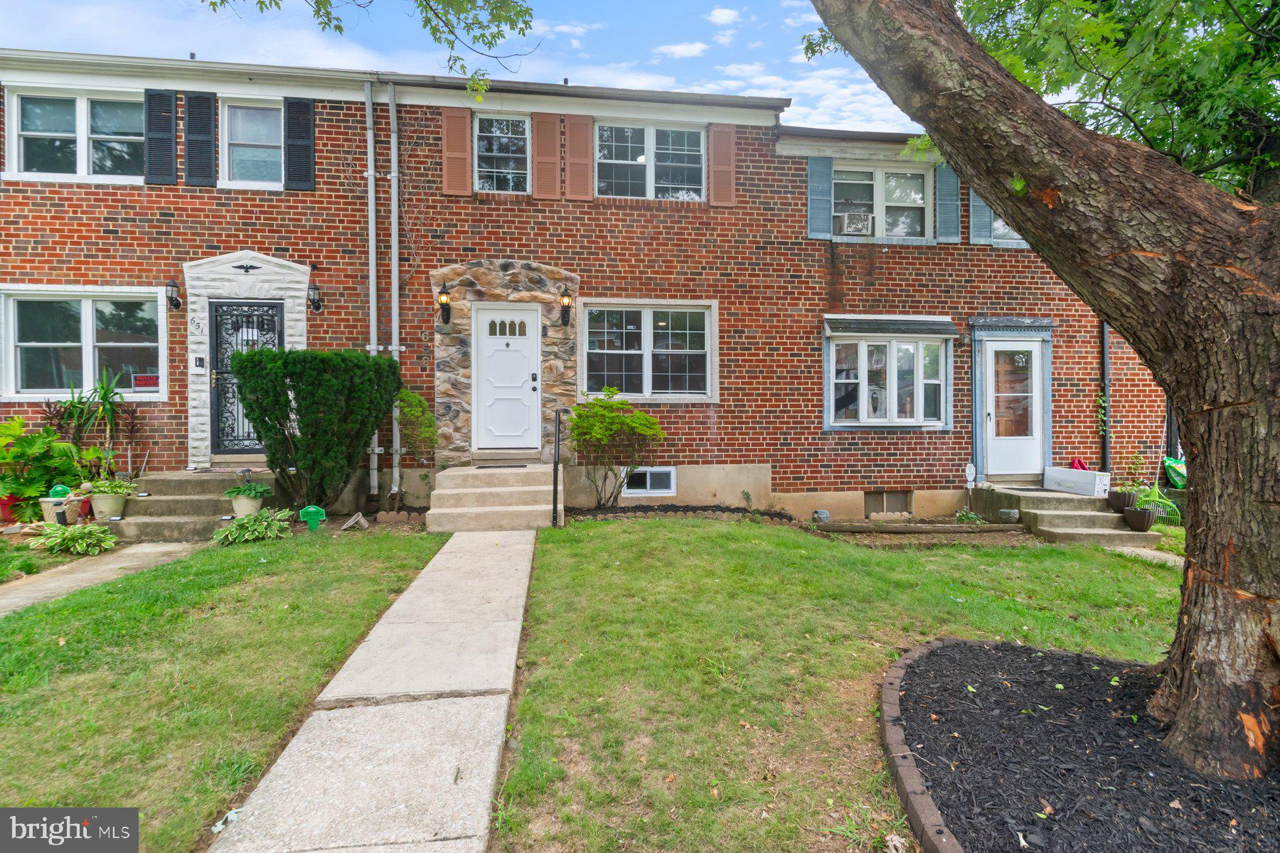 653 Charraway Road Baltimore, MD 21229 - Photo 1 of 27 a front view of a house with garden
