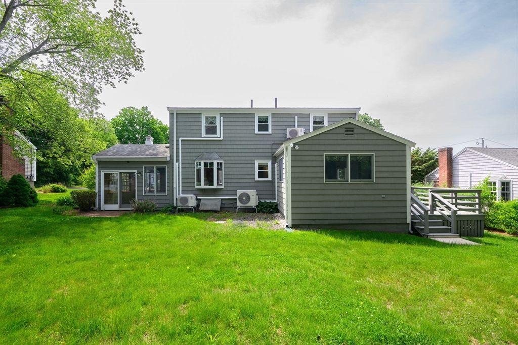 40 Bell Road Weymouth, MA 02188 - Photo 5 of 41 a view of a house with a yard and sitting area