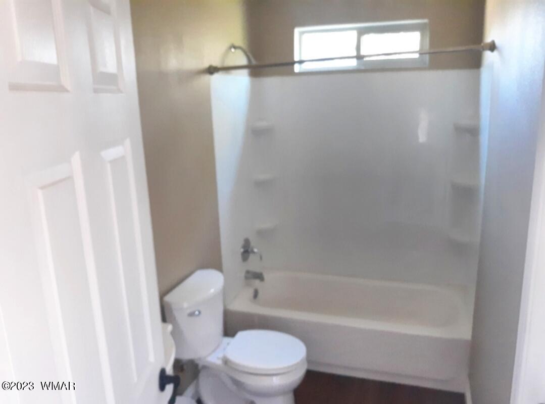 3521 Deer Track Trail Overgaard, AZ 85933 - Photo 6 of 7 a bathroom with a toilet and a bathtub