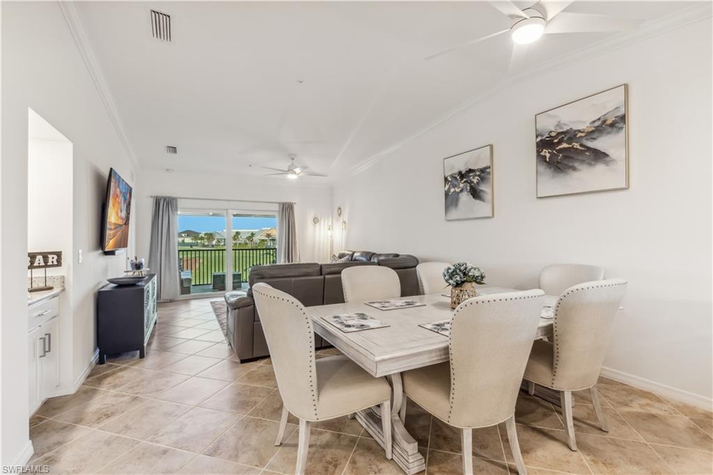 43051 Greenway Boulevard, Unit 822 Babcock Ranch, FL 33982 - Photo 8 of 16 a view of a dining room with furniture