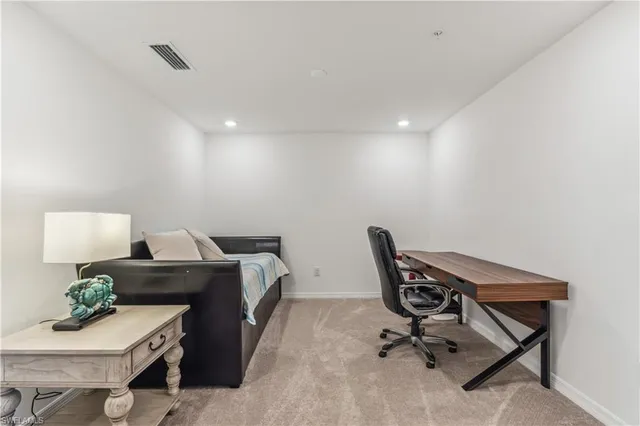 a workspace with furniture and wooden floor