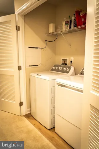a view of a bathroom with a sink and a mirror
